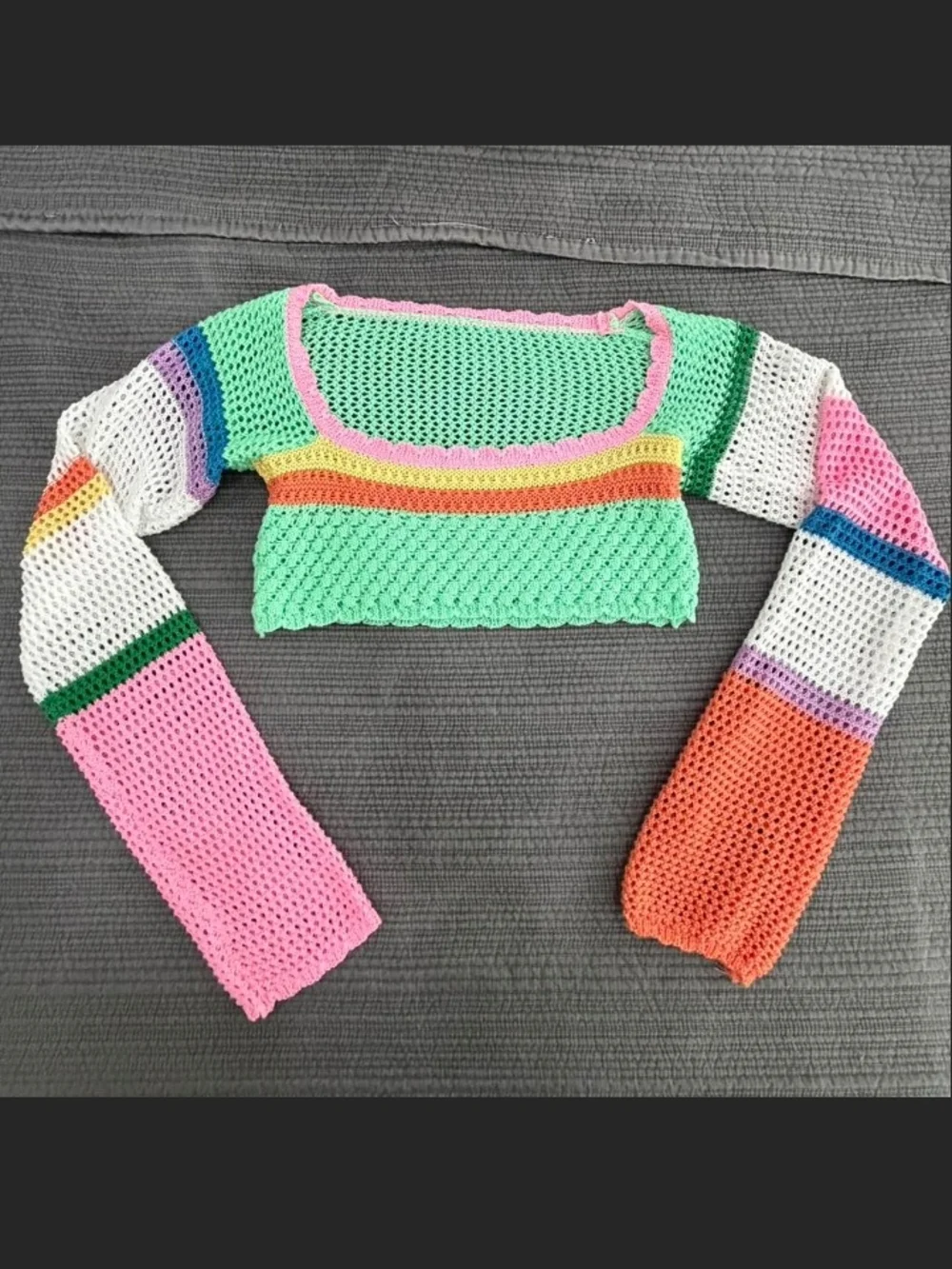 Lady's colorful crocheted long-sleeve crop top